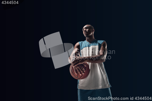 Image of The portrait of a basketball player with ball