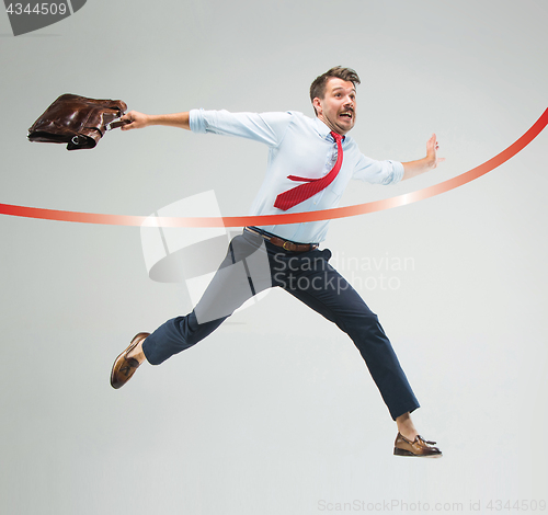 Image of Concept of successful businessman in a finishing line