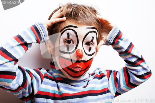 Image of little cute boy with facepaint like clown, pantomimic expression