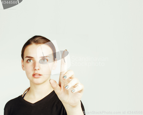 Image of young pretty girl pointing on white background, business science