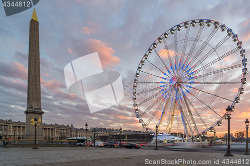 Image of Place de la Concorde at sunset. Ferris wheel and Egyptian obelis