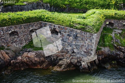 Image of stone walls of Suomenlinna fortress on the shore of the Baltic S