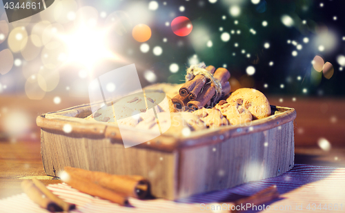 Image of close up of christmas oat cookies on wooden table