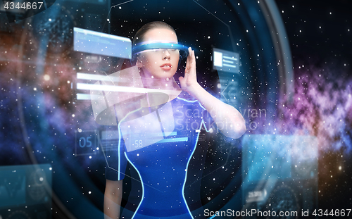 Image of woman in virtual reality 3d glasses with charts