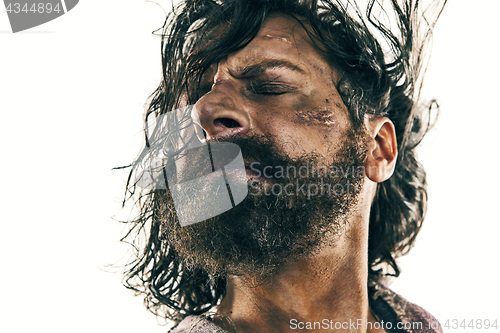 Image of Portrait of a brutal bald-headed viking in a battle posing against a white background.