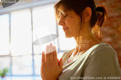 Image of close up of yogi woman meditating at yoga studio