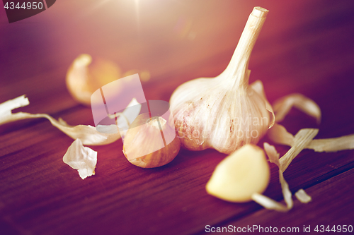 Image of close up of garlic on wooden table