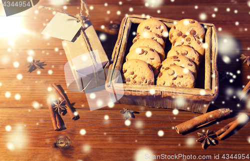 Image of close up of christmas oat cookies on wooden table