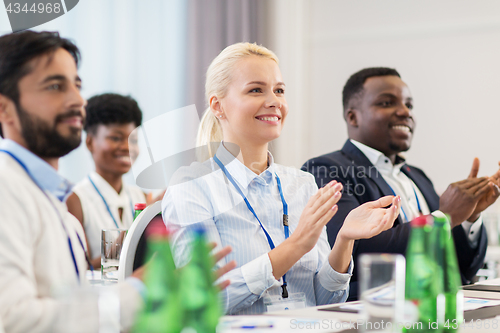 Image of people applauding at business conference