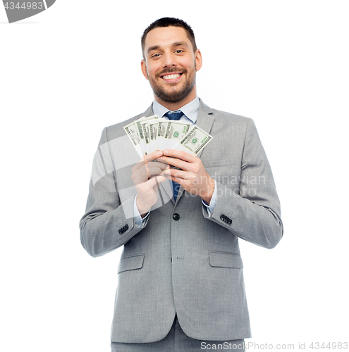 Image of smiling businessman with american dollar money