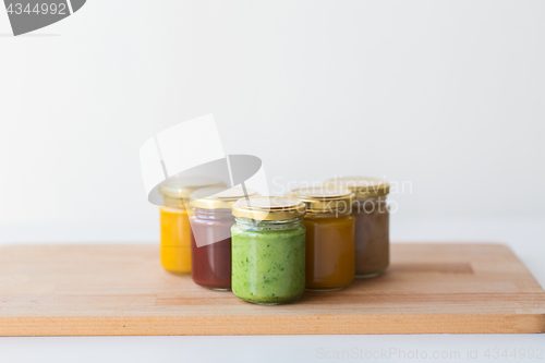 Image of vegetable or fruit puree or baby food in jars