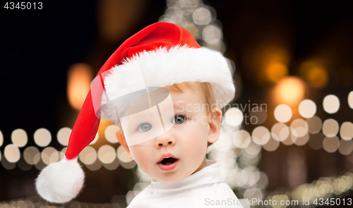 Image of little baby boy in santa hat at christmas