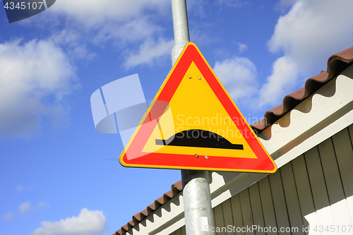 Image of road sign uneven road 