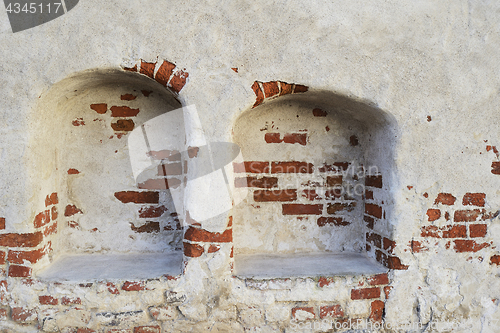 Image of wall of a medieval castle with two recesses