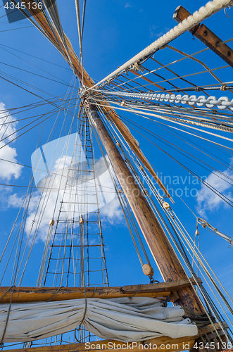 Image of Folded sail and mast on an old sailboat