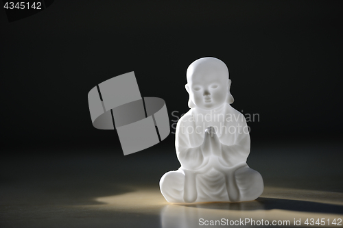 Image of plastic small buddha sculpture