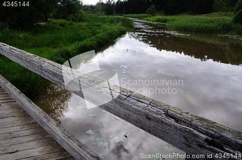 Image of old wooden bridge over the river