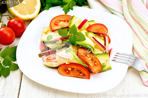 Image of Salad with zucchini and vegetables on board