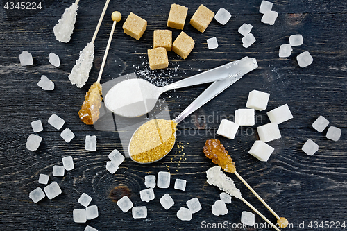 Image of Sugar white and brown different on black board top