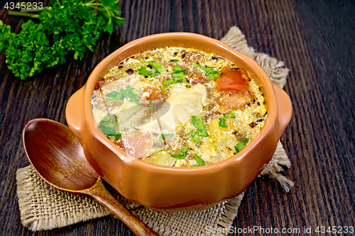 Image of Soup fish with vegetables and herbs on board