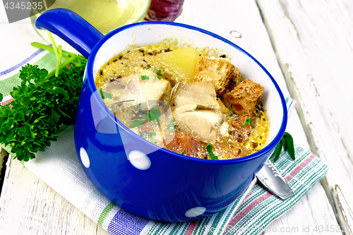 Image of Soup fish with vegetables and cream on light board