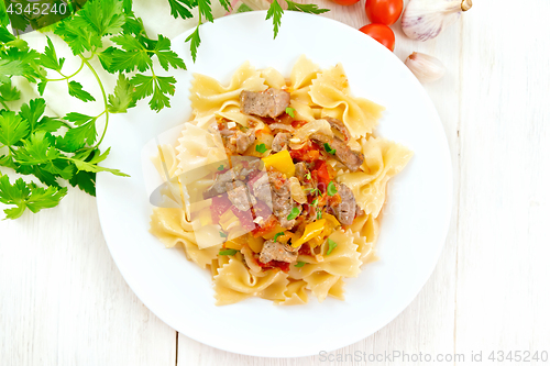 Image of Farfalle with turkey and vegetables on light board top