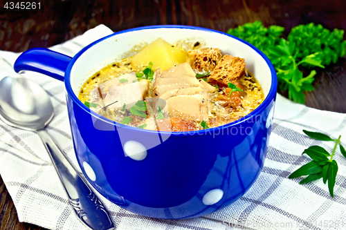 Image of Soup fish with vegetables and herbs on napkin