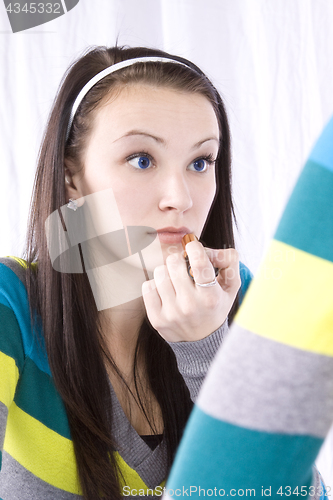 Image of Teenager Putting on Make Up