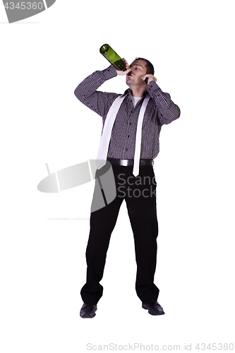 Image of Businessman drinking straight out of the bottle