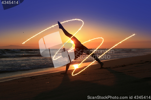 Image of Skilled Young Dancer at the Beach During Sunset