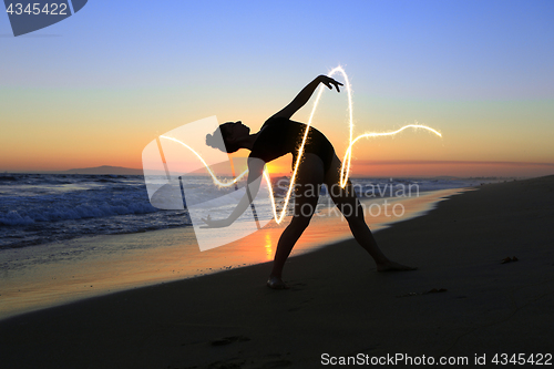 Image of Skilled Young Dancer at the Beach During Sunset