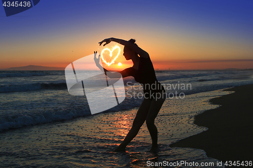 Image of Skilled Young Dancer at the Beach During Sunset