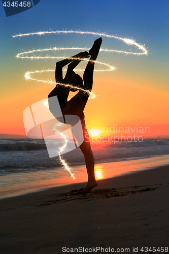 Image of Skilled Young Dancer at the Beach During Sunset