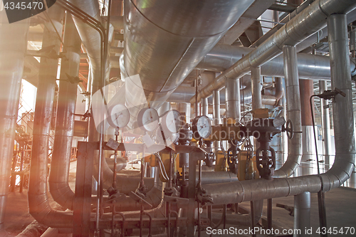 Image of Equipment, cables and piping as found inside of a modern industr