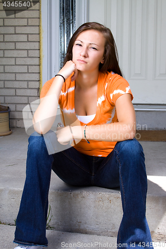 Image of Teenage Girl Sitting Outside