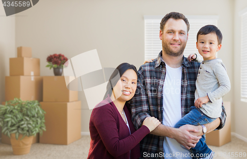 Image of Mixed Race Chinese and Caucasian Parents and Child Inside Empty 