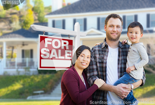 Image of Mixed Race Chinese and Caucasian Parents and Child In Front of H