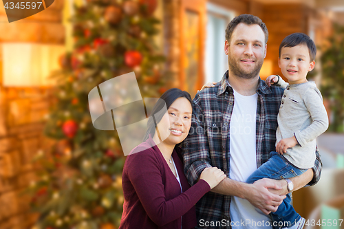 Image of Mixed Race Chinese and Caucasian Parents and Child Indoors In Fr