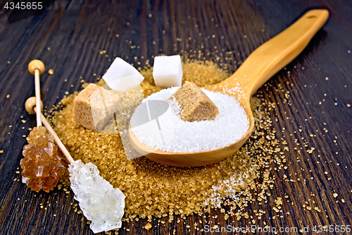 Image of Sugar white and brown on wooden board