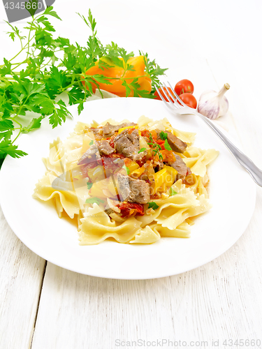 Image of Farfalle with turkey and vegetables on light board