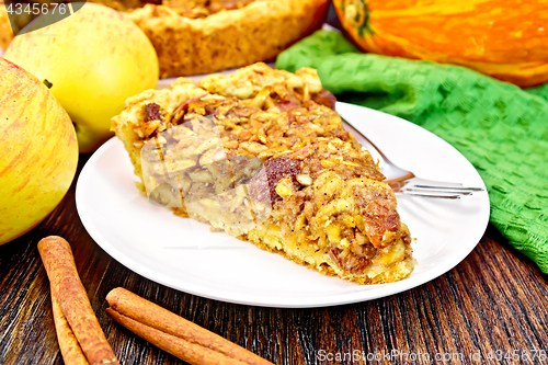Image of Pie with pumpkin and apples on board