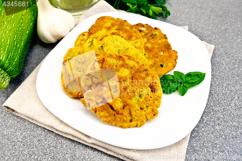 Image of Flapjack chickpeas with zucchini in plate on granite table