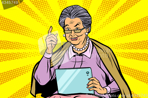 Image of Caucasian elderly woman with a tablet