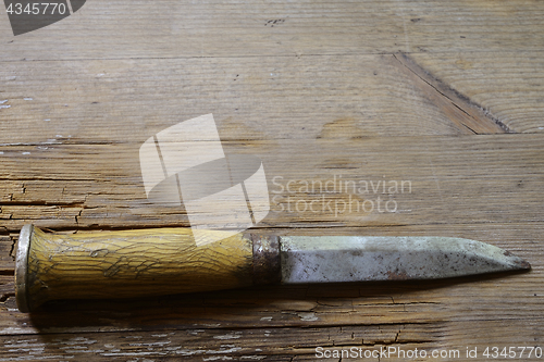 Image of traditional Finnish knife puukko on  a wooden