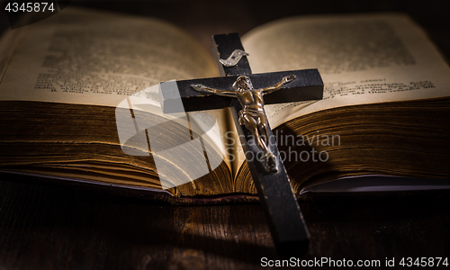 Image of Holy bible with wooden cross