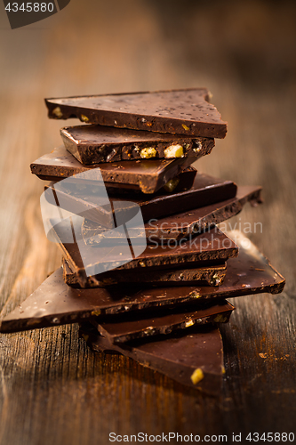 Image of Stack chocolate on wooden table