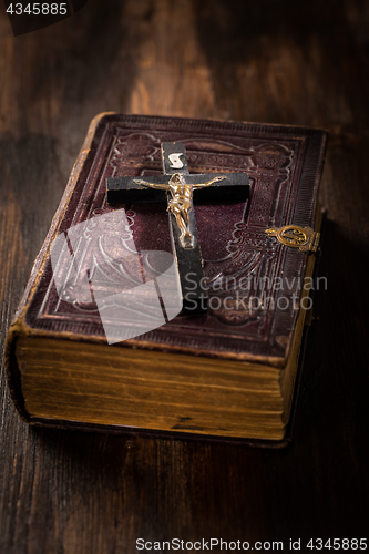 Image of Holy bible with wooden cross