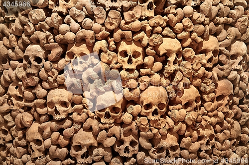 Image of Skulls and bones in a wall