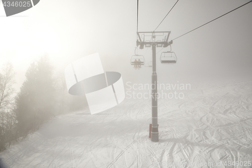 Image of Ski lift in the clouds