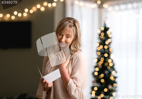 Image of Woman reading a heartfelt message note or card